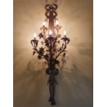 A Fantastic set of four Ormolu Wall Lights with swagged rope backs supporting a bunch of flowers.