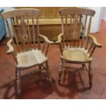 A nice pair of Windsor style Armchairs. H114 x D47 x W67 approx.