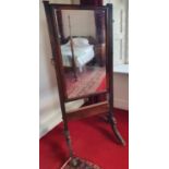 An early 19th Century Mahogany Cheval Mirror with splayed supports and brass castors. H174 x D75 x
