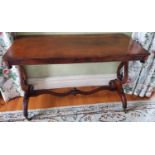 A 19th Century Walnut rectangular Centre Table with an inlaid top, lyre ends and a stretcher base.