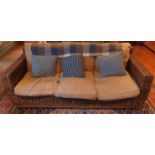A good Wicker three seat Couch and Coffee Table. H88 x D82 x W207cm approx.