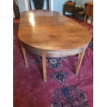 A Georgian Mahogany Dining room Table of simple form with two extra leaves on square supports and