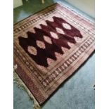 A Brown Bokhara style Rug. 170 x 134cm approx.