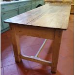 A very large 19th Century Pine four plank Kitchen Table with large square supports and stretcher