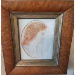A Primitive Watercolour of a red haired Maiden. In a birds eye maple frame. 18 x 14cm approx.