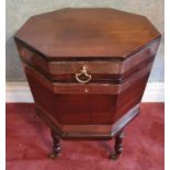 A good Georgian Mahogany octagonal Brass bound Wine Cooler on turned supports with brass castors and