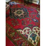 A beautiful red ground Persian Tabriz Carpet with unique medallion design and with a surrounding