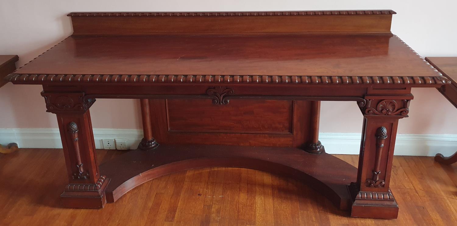 A fantastic 19th Century Irish Serving Table with a highly carved outline, the molded and carved top