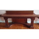 A fantastic 19th Century Irish Serving Table with a highly carved outline, the molded and carved top