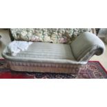 A 19th Century fully upholstered daybed with turned supports and brass castors. (one leg loose). H67