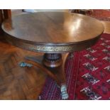 A Magnificent Regency Rosewood circular Centre Library Table with Brass inlay. The Frieze