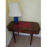 An Edwardian Rosewood twin drawer Writing Desk with twin lidded sides on tapered inlaid supports.