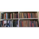 A really good quantity of Books on four shelves.