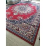 A really good red ground Carpet, Belgian Wool. With blues and cream multi borders and circular