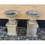 A lovely pair of reconstructed Stone Urns on stands. H76 x Diam.40cm approx.