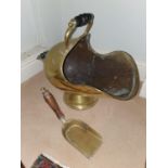 A 19th Century Brass Coal Helmet along with a spark guard. L22 x D35 x W143cm approx.
