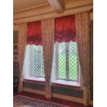 A lovely set of three Curtains with tie backs on curtain pole and swags and window seat cushions.