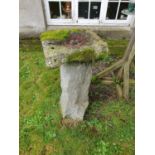 A hand cut stone Bird Bath along with a Bird Table.