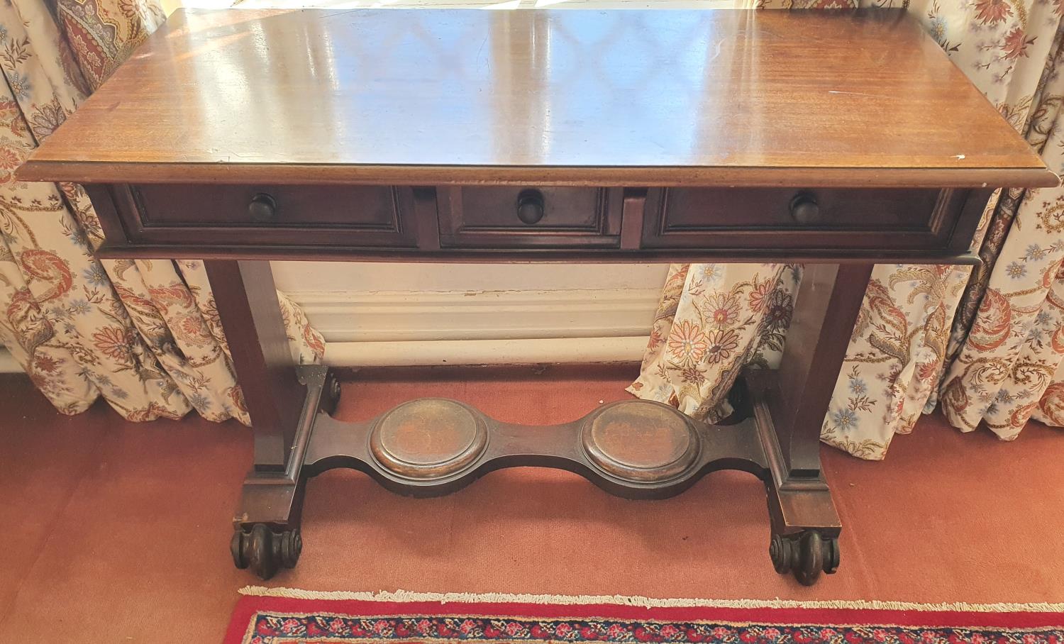 An early 19th Century triple drawer Side Table with stretcher base. H74 x D48 x W104cm approx.