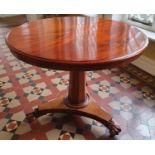 A Victorian Mahogany circular Centre Table with platform base and hairy paw feet. D90 x H72cm