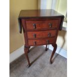 An Edwardian Mahogany Dropflap Side table with triple drawer front. H76 x D34 x W68cm approx.