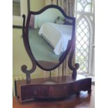 A really good Regency Mahogany Inlaid Crutch Mirror with serpentine outline and shield shaped