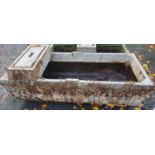 A large Concrete Water Trough.