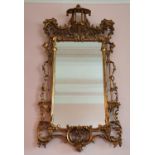 A Magnificent pair of Gilt Wall Mirrors in the Chinese Chippendale taste with highly pierced