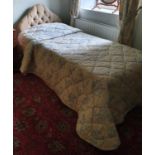 A Single bed, Bedspread, Mattress, Lamp and other items.