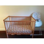 A Childs Cot. H97 x D63 x W120cm approx., a High Chair, a Dolls House and a Pram.