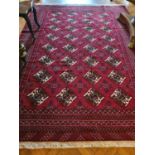 A Persian Surok Village Carpet full pile handwoven Red field with a central medallion with hints
