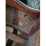 A 19th Century Mahogany Cot with cane work exterior. L103 x W45 x H122cm approx.