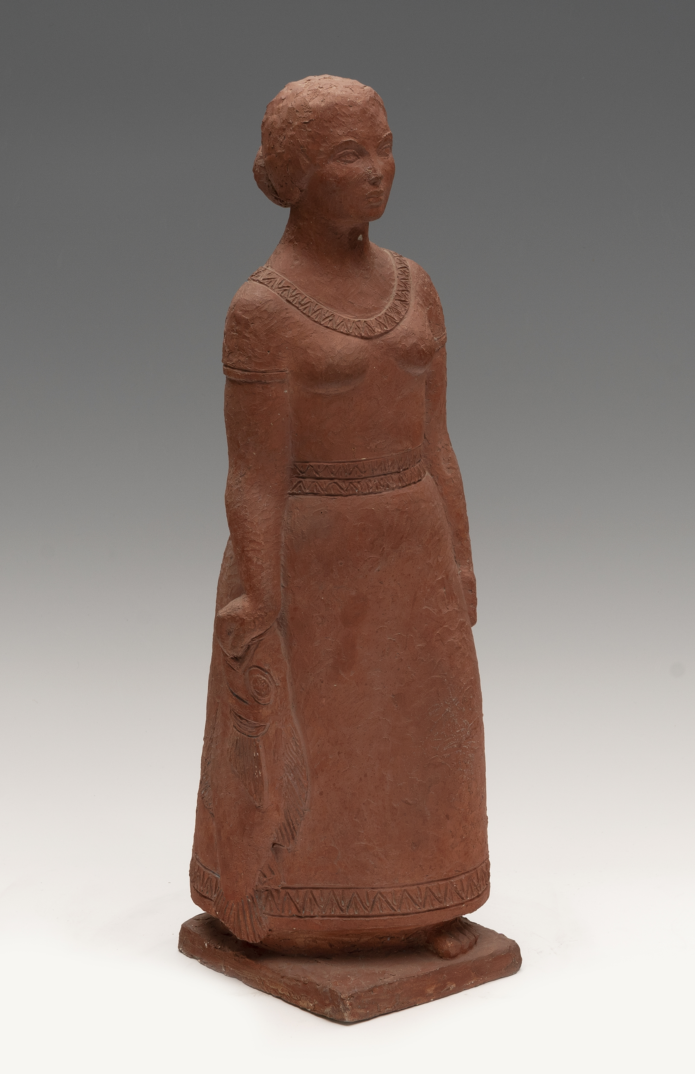 PALMIRA COLLELL (Barcelona, ?-2018). "Woman holding a fish", 1973. Terracotta. Signed on the back of