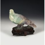 Pair of pigeons. China, 20th century. Jade carved by hand on wooden base. Measurements: 10 x 15 x