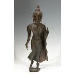 Buddha figure; Indonesia, Java, VII-X centuries. Bronze, with traces of polychrome. Wooden base,