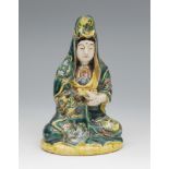 Figure of Guanyin. China, end of XIX century-pps. XX. In glazed porcelain. Measurements: 18 x 11 x 9