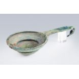 Etruscan ceremonial strainer. VI-V B.C. Bronze. Measures: 5 x 23 x 11 cm. The Etruscans used this