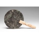 Roman hand mirror, 1st - 3rd century AD. Bronze with bone handle. Measurements: 16,5 x 10 cm.