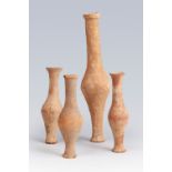 Four Roman ointments, 2nd century AD. Terracotta. Measurements: 21 cm (height of the tallest); 12 cm