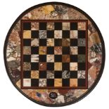 Table; Rome, XIX century. Marble, hard stones and ebonized wood. Presents loss of one of the
