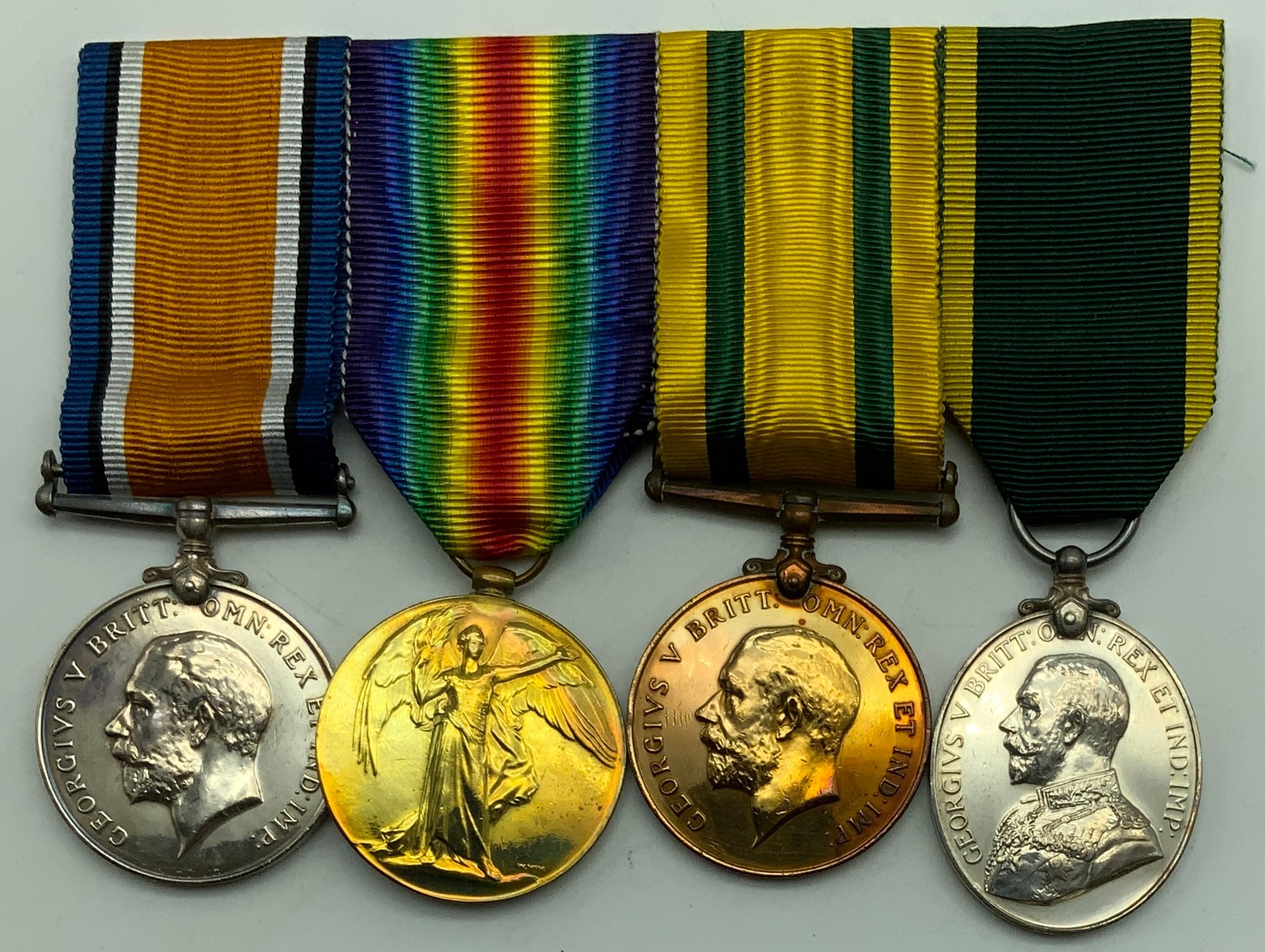 WWI GROUP OF FOUR MEDALS INCLUDING TERRITORIAL MEDALS AWARDED TO M.H. BELL. R.E.