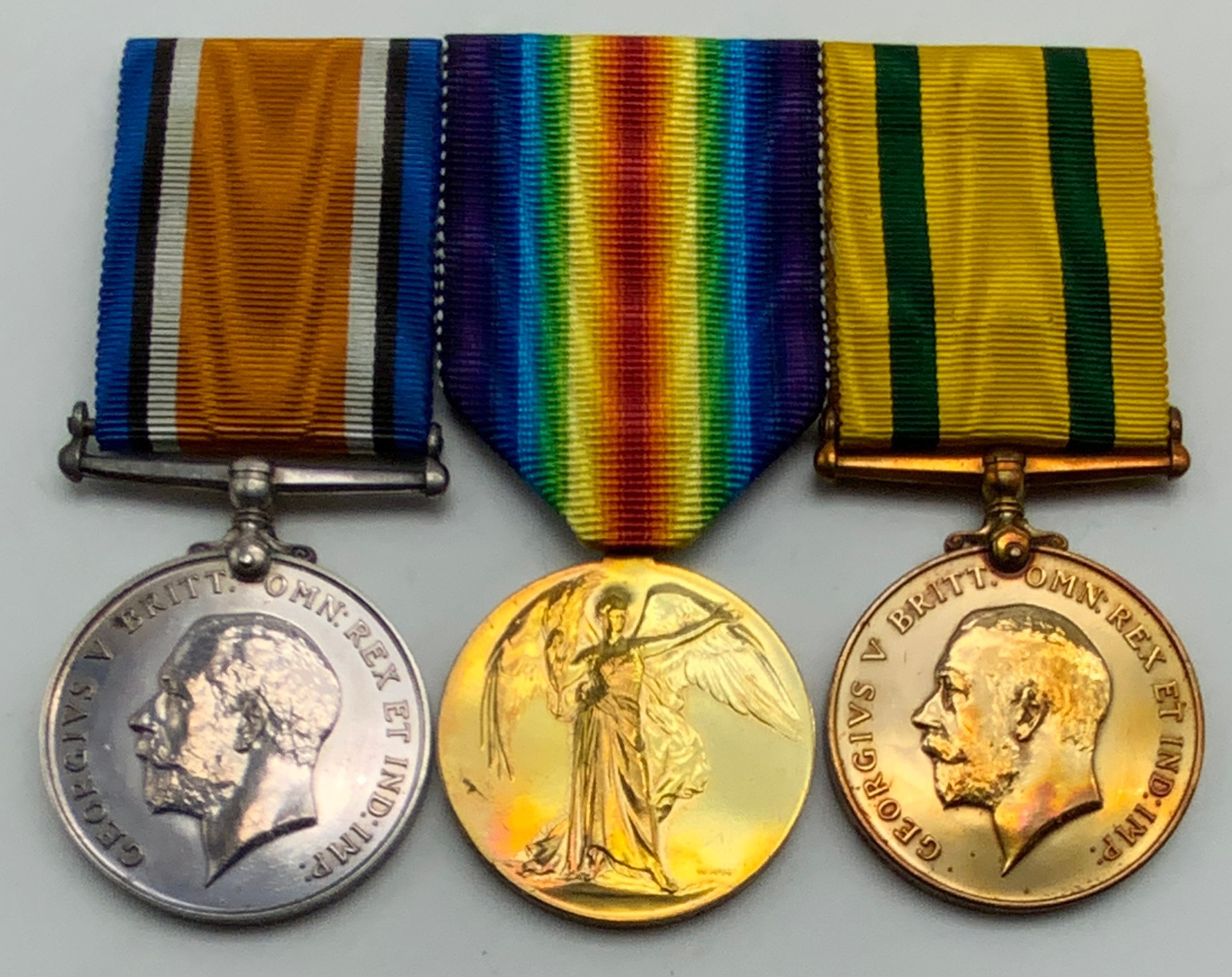 WWI GROUP OF THREE MEDALS INCLUDING TERRITORIAL FORCE WAR MEDAL 965220 GNR. T. DANIELS. R.A.