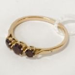 21CT GOLD & GARNET TRILOGY RING