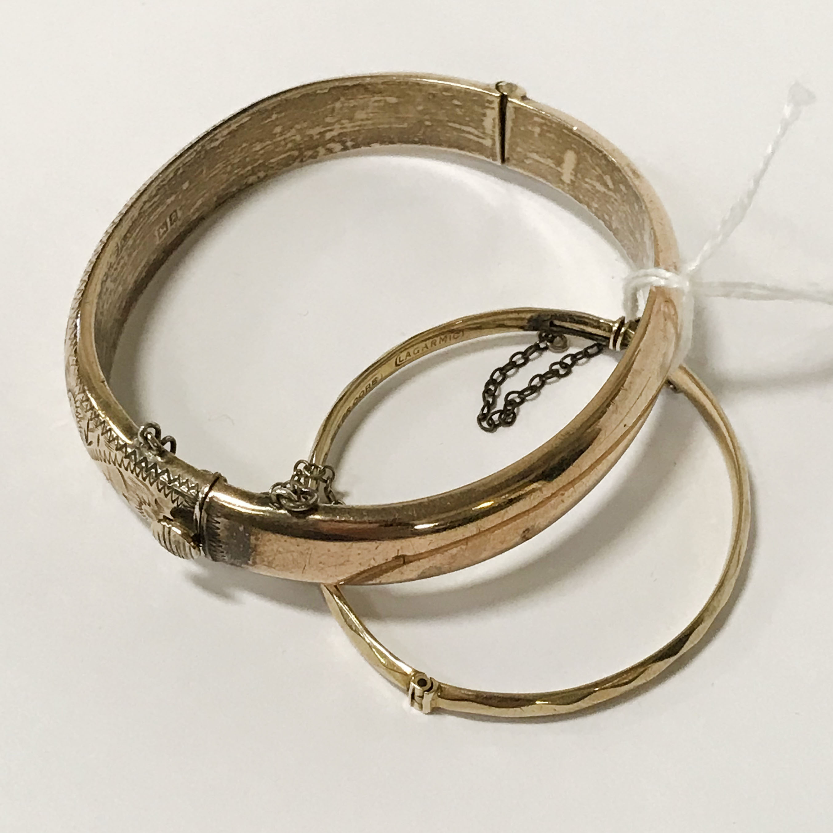TWO PIECES OF 9CT GOLD PLATED SILVER CORE BANGLES