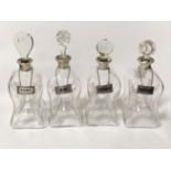 FOUR ASPREY SILVER COLLAR DECANTERS WITH SILVER DRINK LABEL