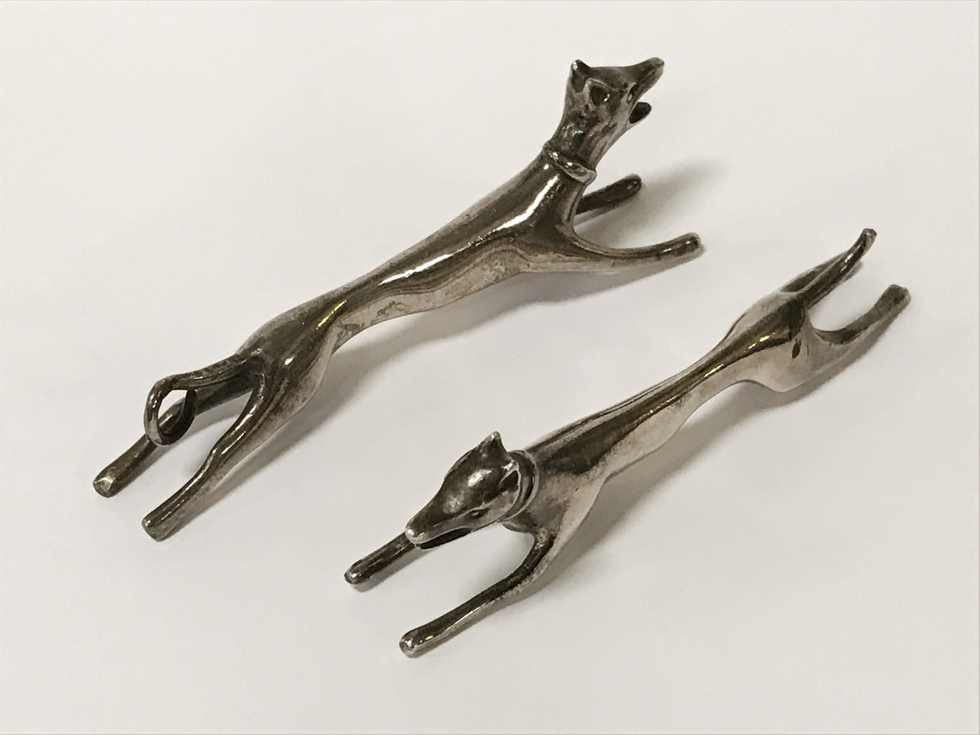 TWO SILVER KNIFE HOLDERS