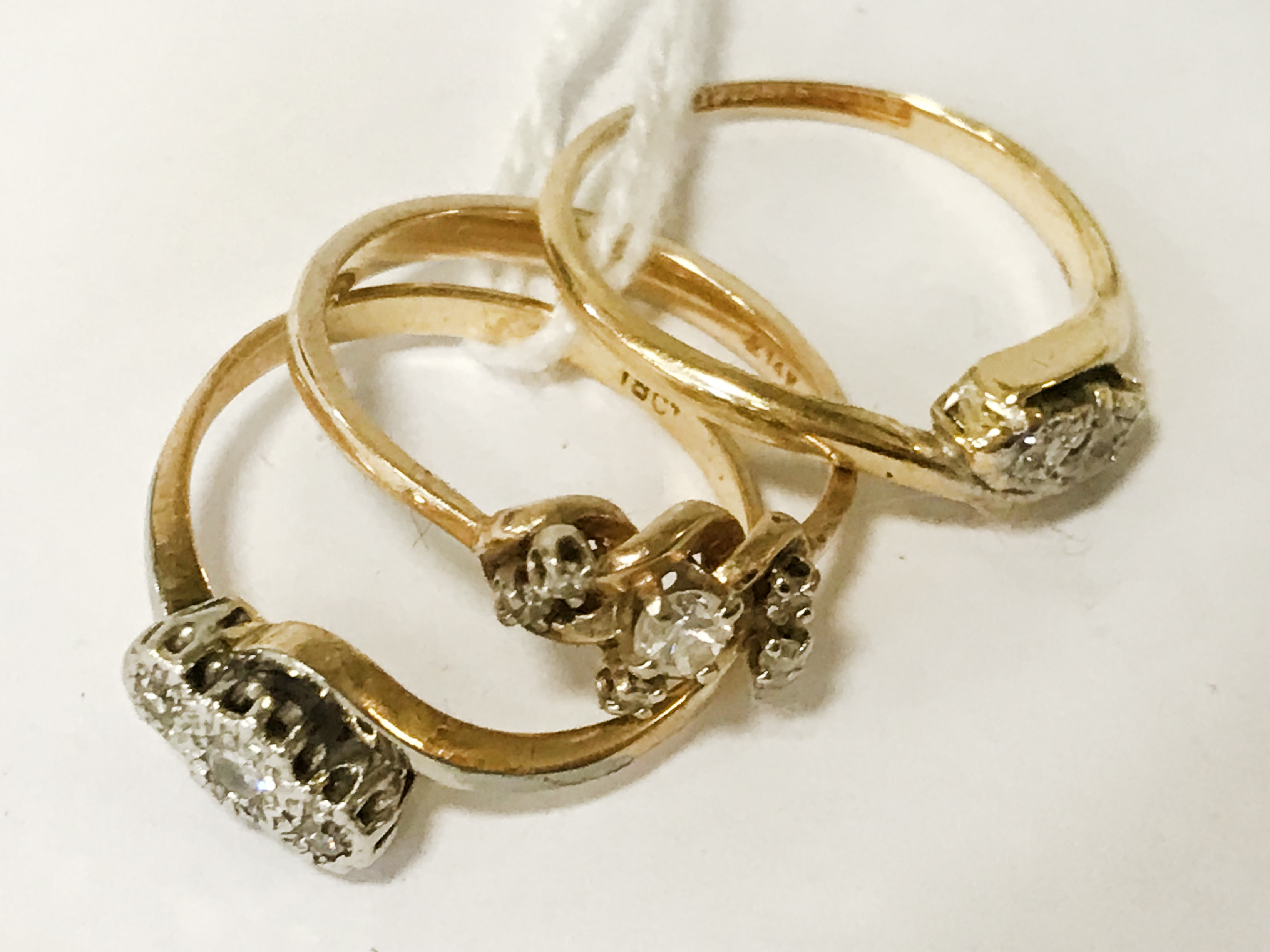 THREE 18CT GOLD RINGS WITH DIAMONDS