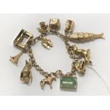 9CT GOLD CHARM BRACELET - APPROX 46 GRAMS