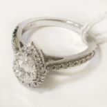 18 CT. WHITE GOLD PEAR SHAPED DIAMOND RING CENTRE STONE IS 0.50 CARATS TOTAL DIAMOND WEIGHT IS 0.