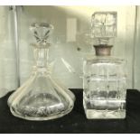 TWO DECANTERS - 1 WITH HM SILVER TOP - TALLEST 25 CMS